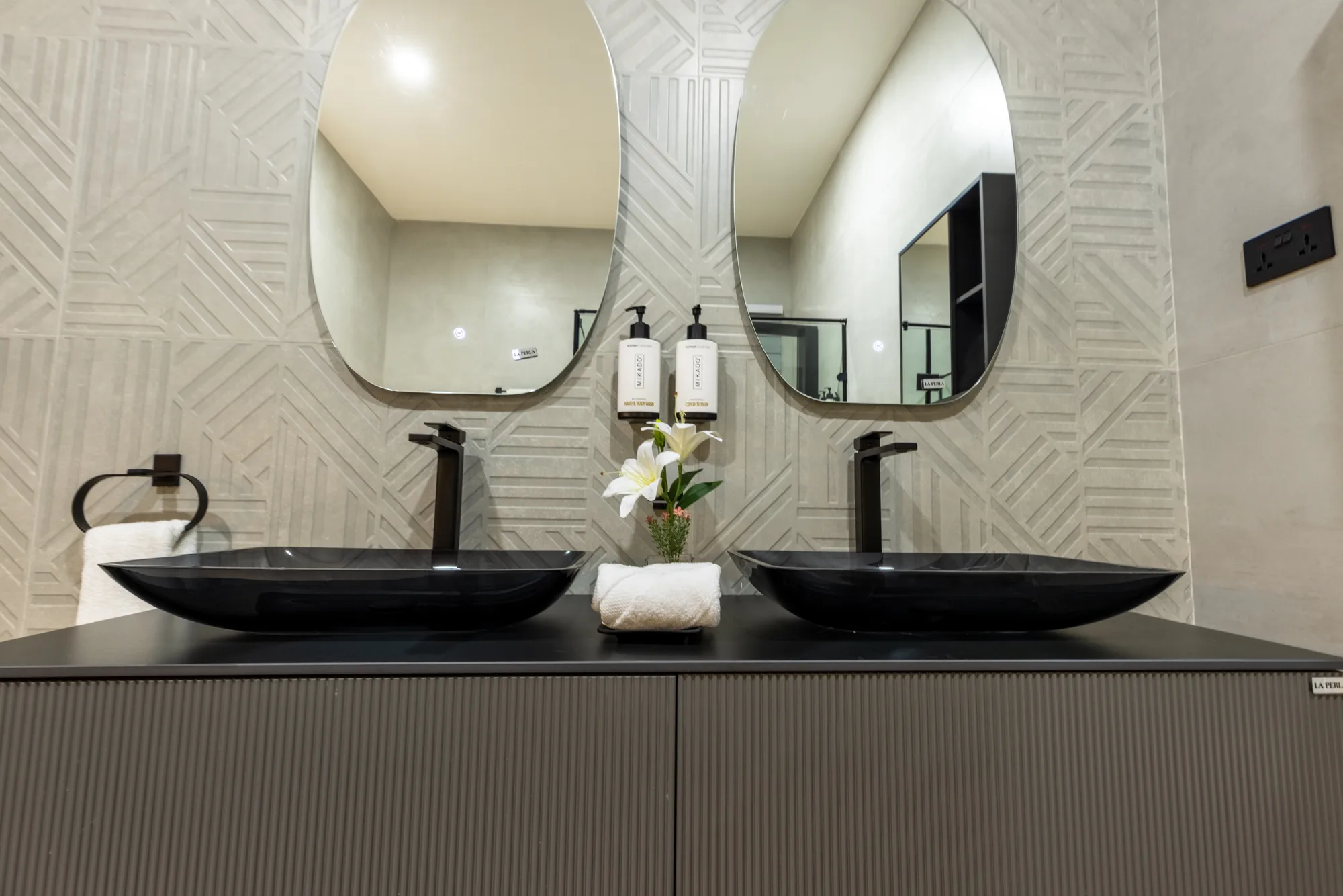 Residence One dark double vanity with illuminated mirrors