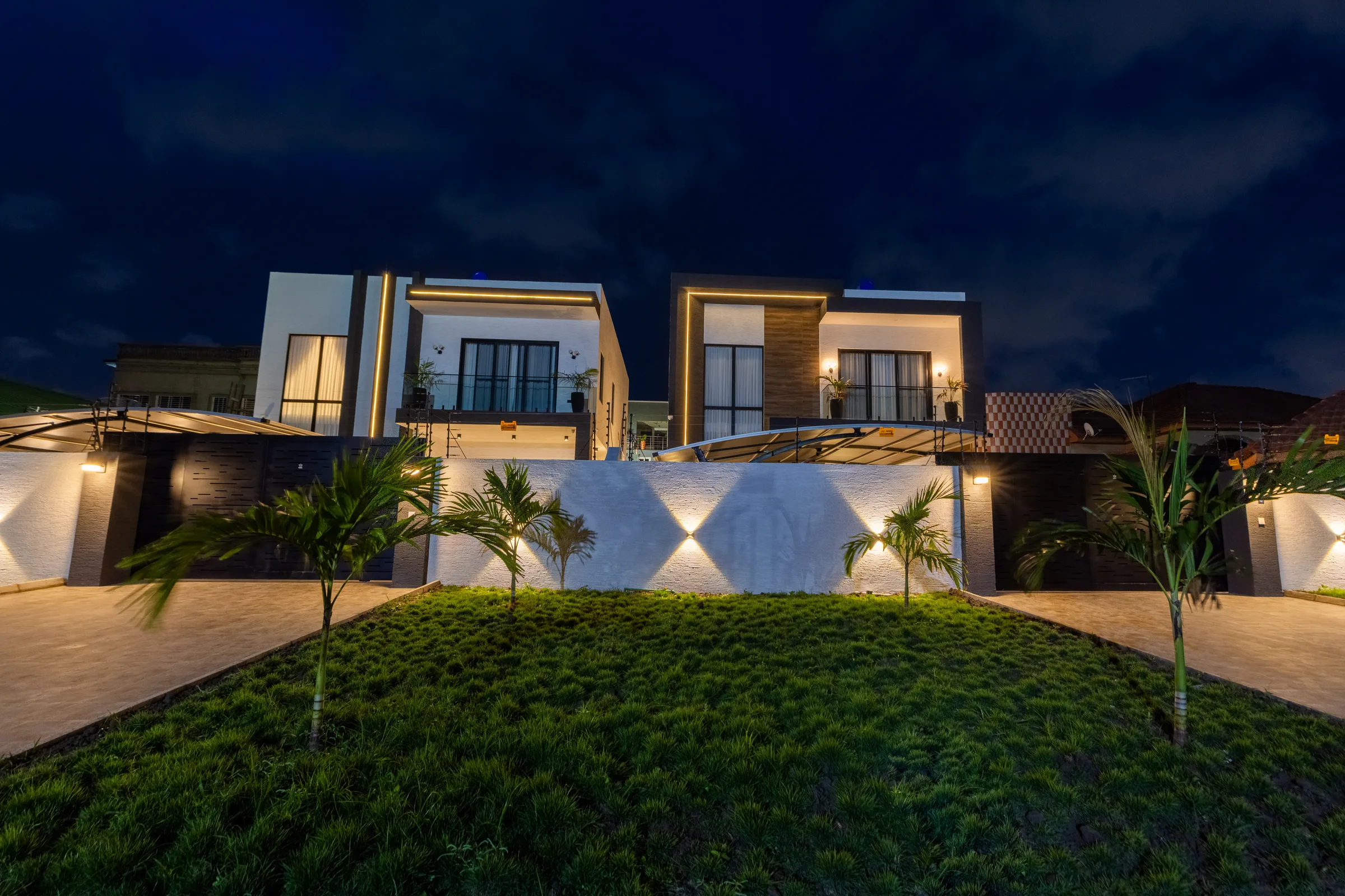 Four contemporary private residences at dusk