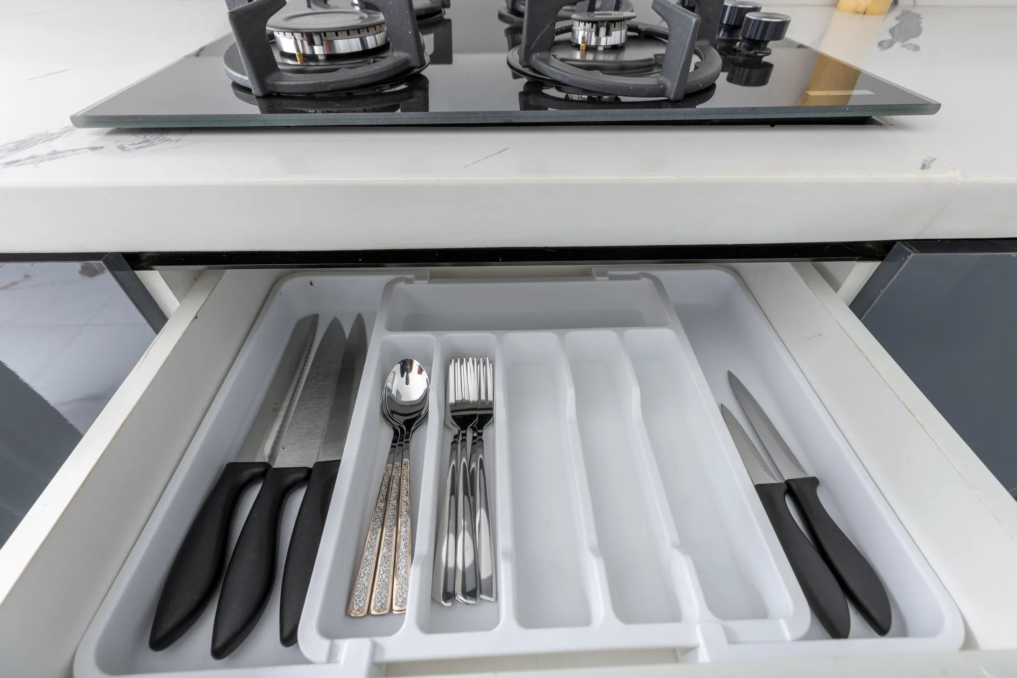 Residence Two cooktop and utensil drawer detail