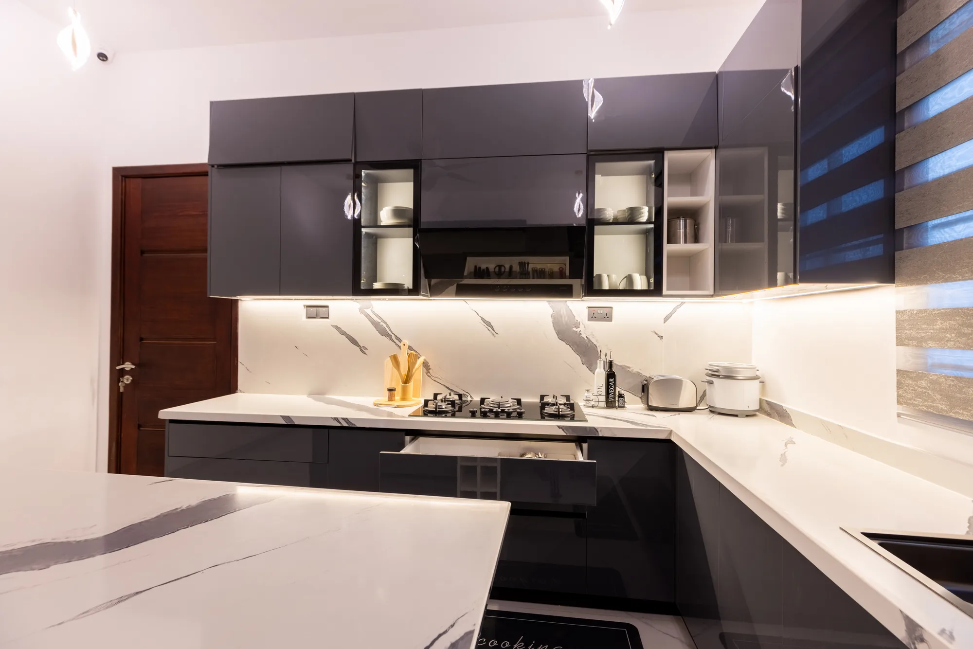 Illuminated kitchen cabinetry and counter storage