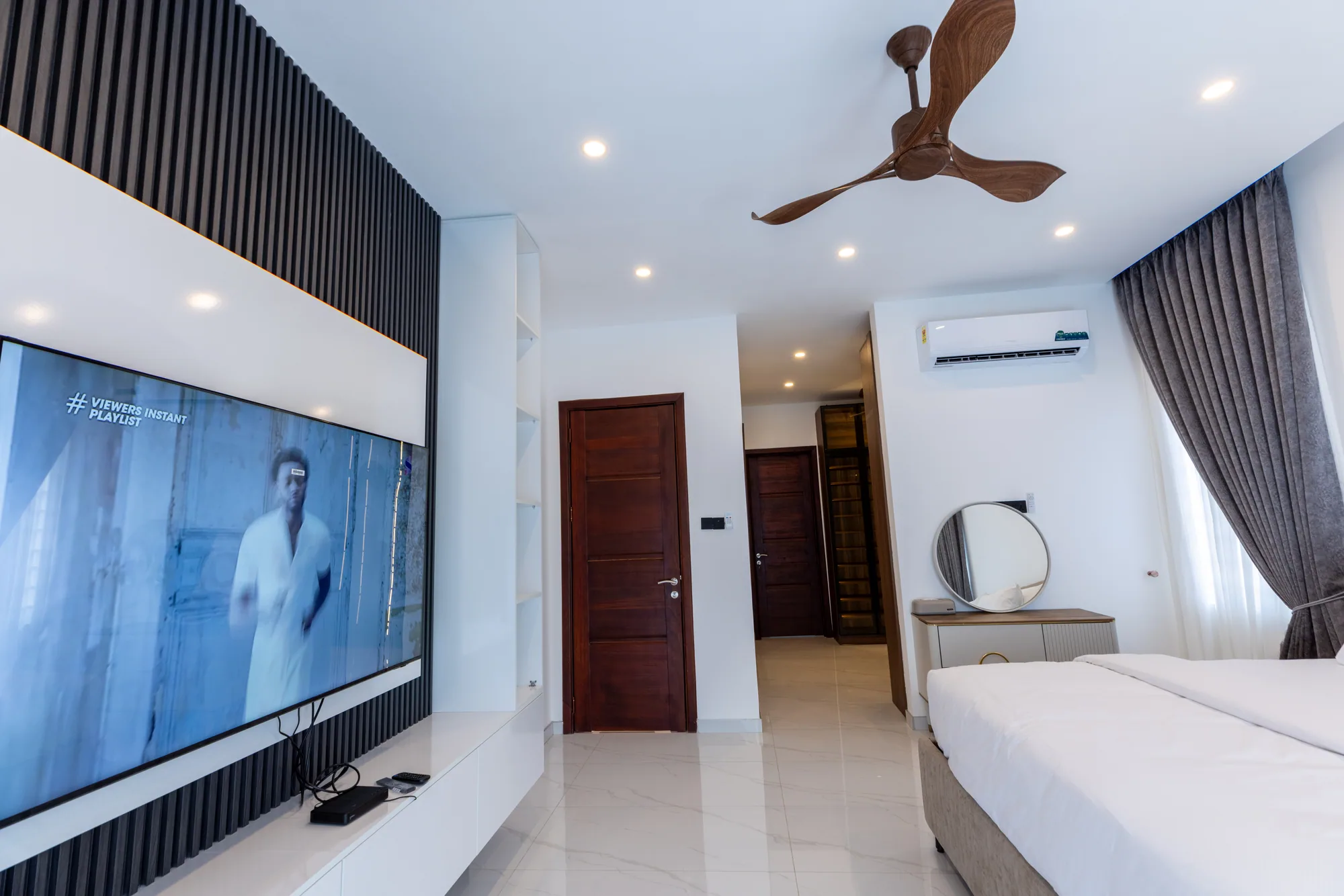 Bedroom suite with integrated media wall