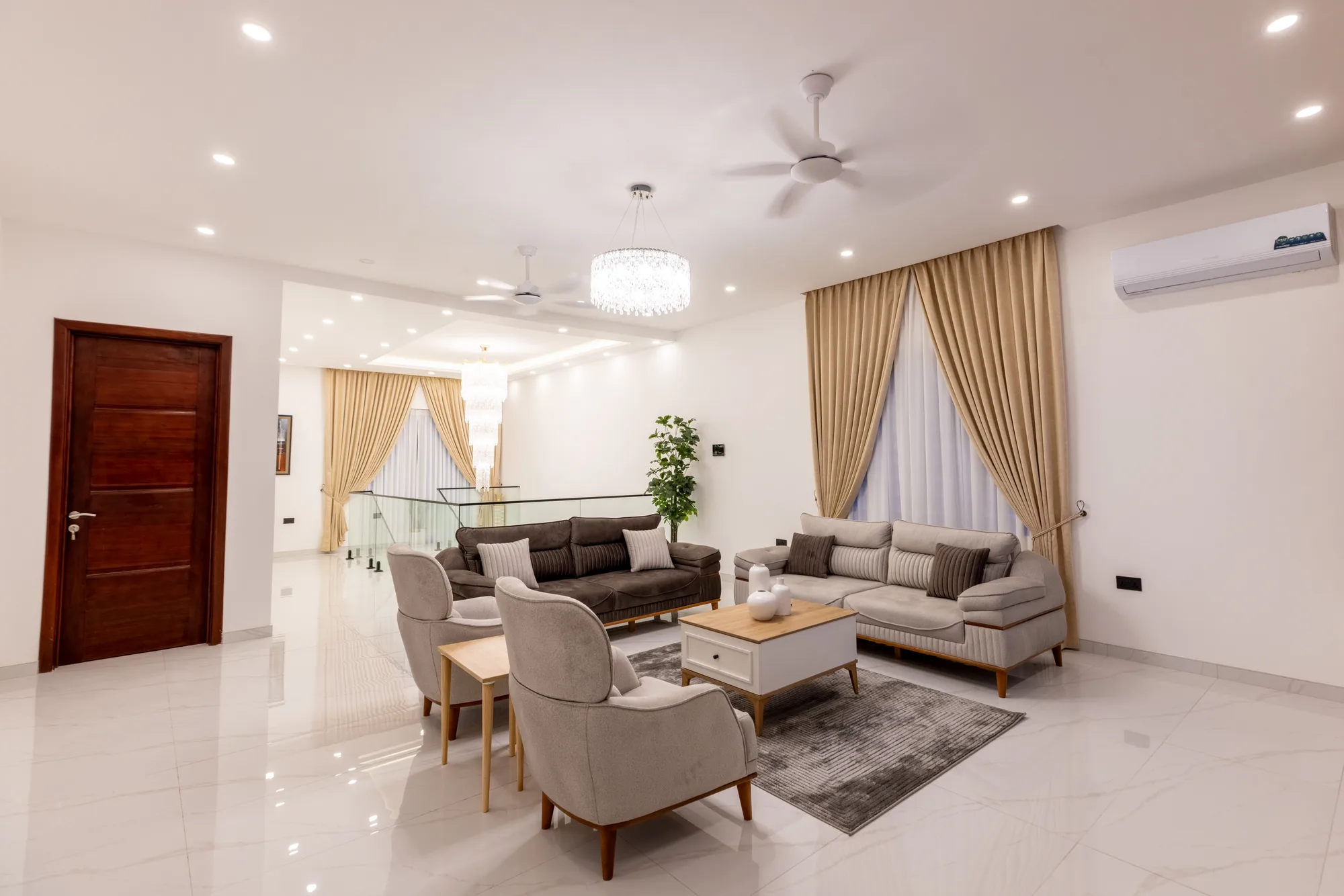 Residence One light contemporary living room with warm curtains
